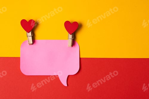 Preview: pink notes on a yellow-red background and clothespins with hearts