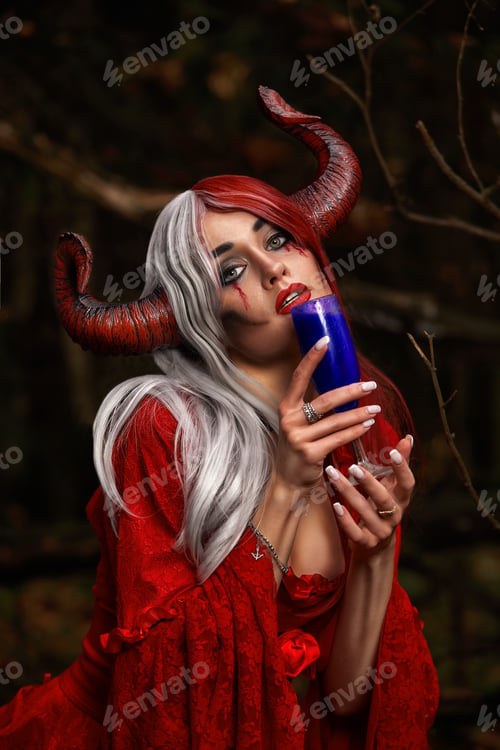 Preview: Stylish and fashionable model girl in the image of Maleficent posing among mystic forest - fairytale