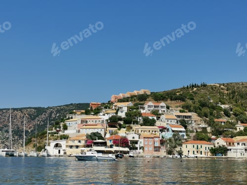 Preview: Beautiful sailing yacht near picturesque seacoast. Assos village Mediterranean Sea, Greece. Summer