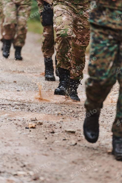 Preview: Close up photo, the resilient legs of elite soldiers, clad in camouflage boots, stride purposefully