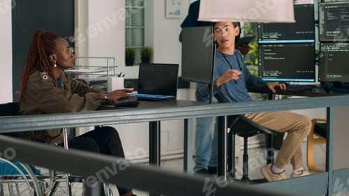 Preview: African american developer with disability working with programming language