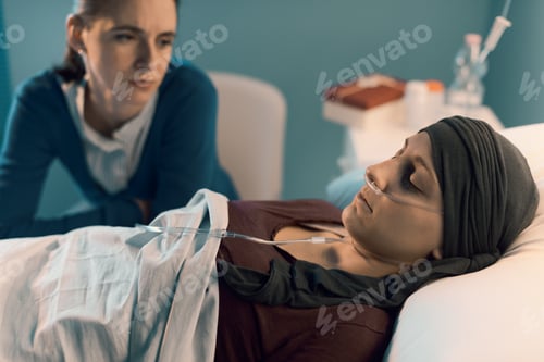 Preview: Caring woman assisting her friend with cancer at hospital