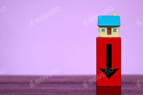 Preview: Miniature house and red wooden cube with downward arrow.