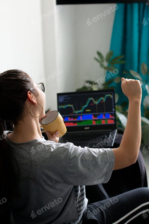 Preview: Stock market and investing concept with trader working on laptop. Businesswoman celebrating.