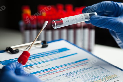 Preview: Lab technician holding swab collection kit