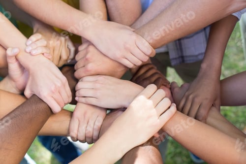 Preview: Friends Putting Their Hands Together On A Sunny Day