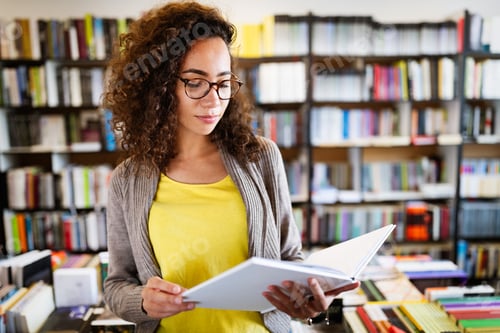 Preview: Education, high school, university, learning and people concept. Smiling student girl reading book