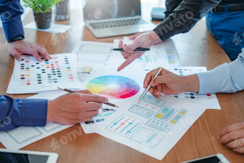 Preview: Creative web designers and applications work together in the office.