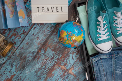 Preview: Travelling preparations flat lay with luggage, camera, sun glasses