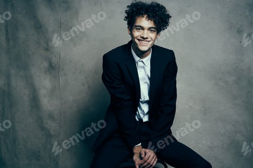 Preview: business man in suit self confidence curly hair fashion studio