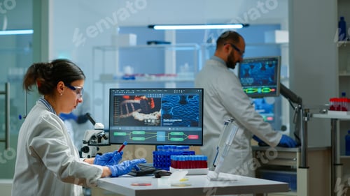 Preview: Team of microbiology scientists discussing about virus development
