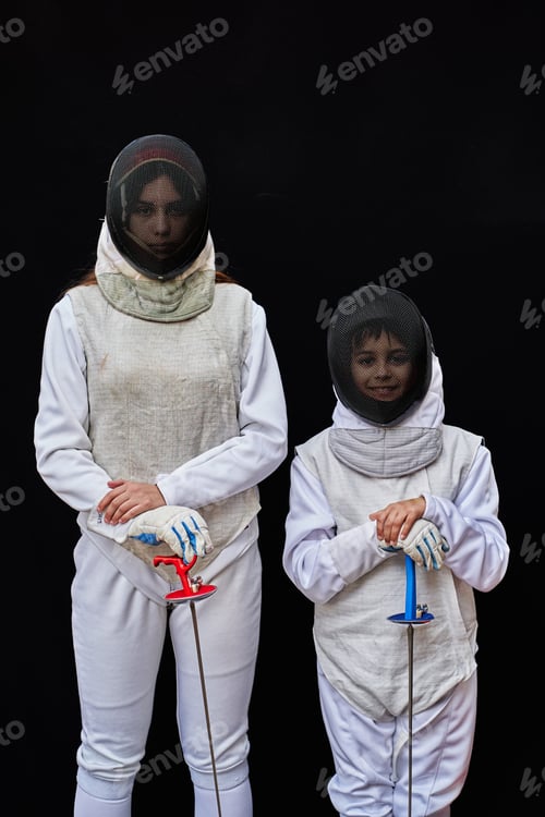 Preview: Portrait of two young fencer wearing on black background
