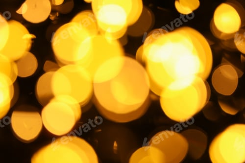 Preview: Abstract bright yellow bokeh background for holiday concepts
