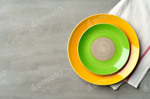 Preview: Top view of ceramic plate with table napkin on gray background