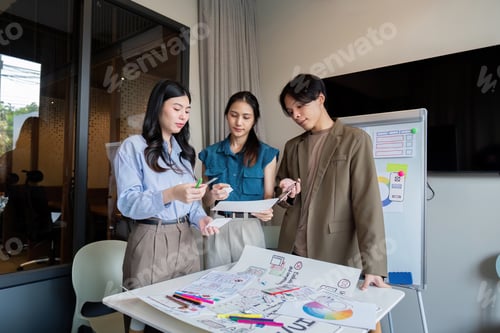 Preview: ux developer and ui designer presenting mobile app interface design on whiteboard in meeting at