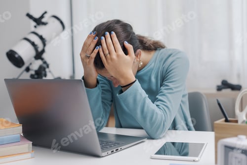 Preview: Shocked student connecting online with a laptop