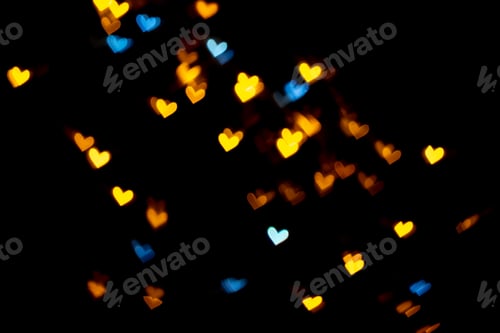 Preview: Yellow gold and blue heart on black background Colorful lighting bokeh for decoration Valentine