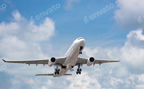 Preview: Passenger airplane taking off in bright cloudy sky. Wide-body commercial airliner over blue sky
