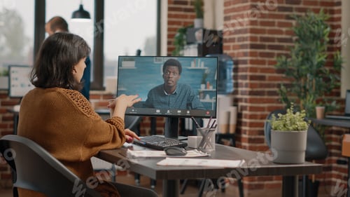 Preview: Business woman having discussion with man on video call
