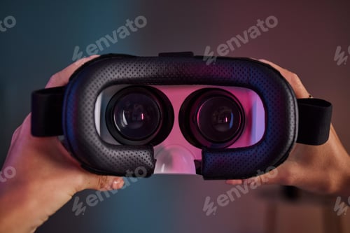 Preview: Virtual reality glasses in hands, metaverse and future technology, video gaming and UX with woman a
