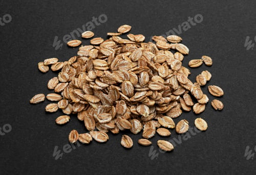 Preview: Top view of oat flakes on black background