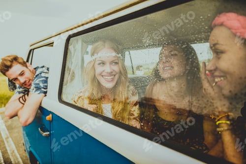 Preview: Happy friends driving a vintage minivan