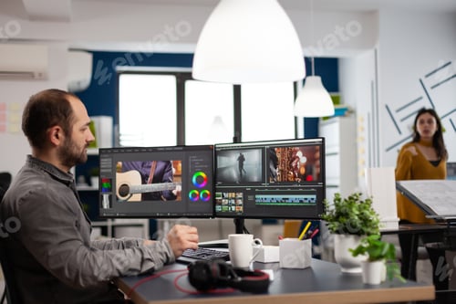 Preview: Video editor man editing movie project working in start up creativity multimedia agency