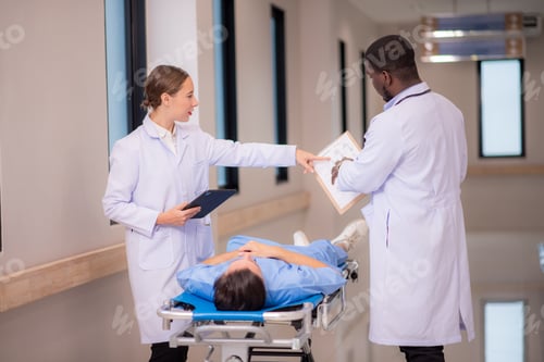 Preview: medics and patient on hospital gurney at emergency