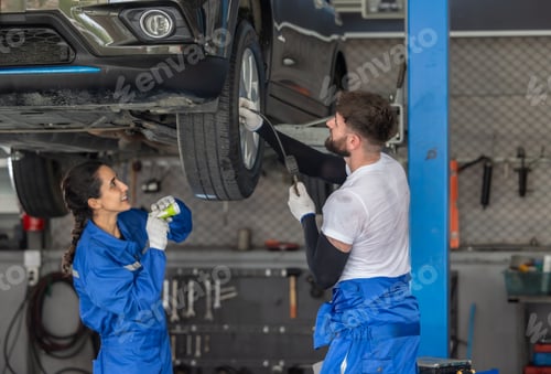 Preview: Car technicians analyze, fix wheel issues in garage, using precise tools for optimal alignment.