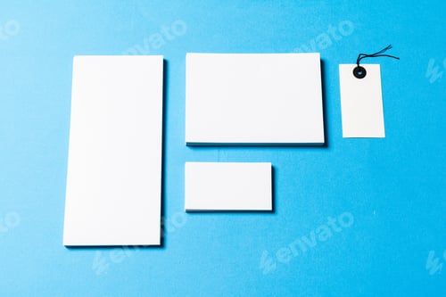 Preview: blank office objects organized for company presentation on blue paper background