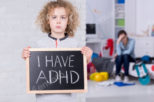 Preview: Boy holding blackboard