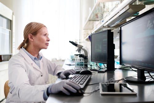 Preview: Female Laboratory Specialist Working on Computer