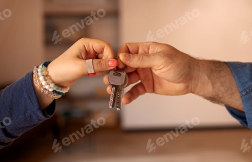 Preview: Realtor woman giving customer hand keys