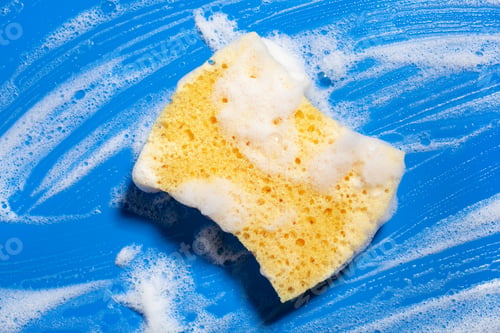 Preview: cleaning sponge wiping foam soap suds on blue background, household washing concept