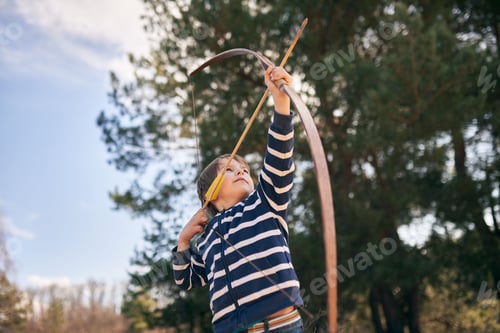 Preview: Boy 6 year old shoots a bow in the open air