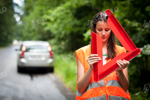 Preview: Young female driver wearing a high visibility vest/safety vest,