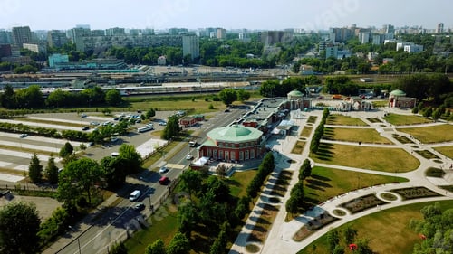 Preview: The city from a helicopter.Creative.A beautiful city center in which houses, buildings, bright trees