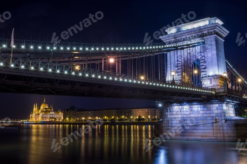 Preview: The night view of the Parlament building and the Danube under th