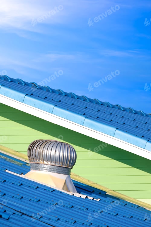 Preview: Round aluminium ventilator on blue fiber cement tile polygonal roof against blue sky background