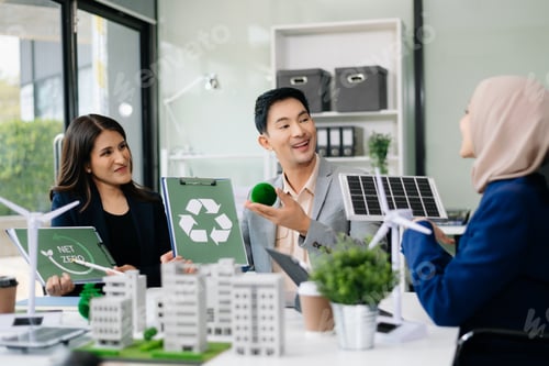 Preview: Business people having consultation about wind energy at company office. Business team discussing