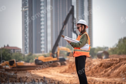 Preview: Engineer worker operations construction plans large black drainage pipe
