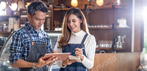 Preview: Young Business Professionals Working Together in a Cafe