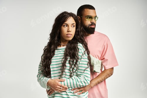 Preview: Stylish couple in a creative expression of love and connection during a fashion shoot