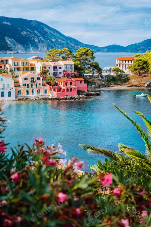 Preview: Beautiful view of Assos village with vivid colorful houses near blue turquoise colored and