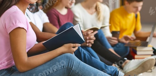 Preview: Group of international student studying in library
