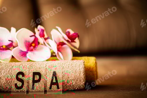 Preview: Chocolate Spa. Composition brown towel in hotel room of spa treatment.