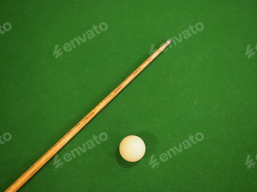 Preview: Sports game of billiards on a green cloth. one cue and a cue ball on a pool table