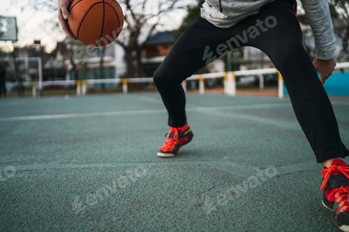 Preview: Young man playing basketball.