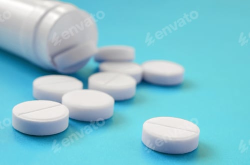 Preview: Several white tablets fall out of the plastic jar on the blue surface. Background image on me