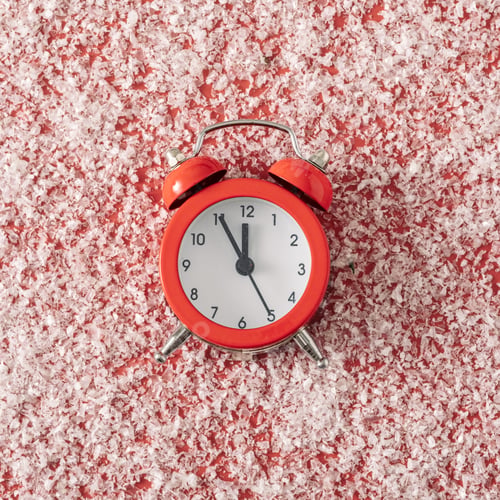 Preview: Classic retro alarm clock on a red background